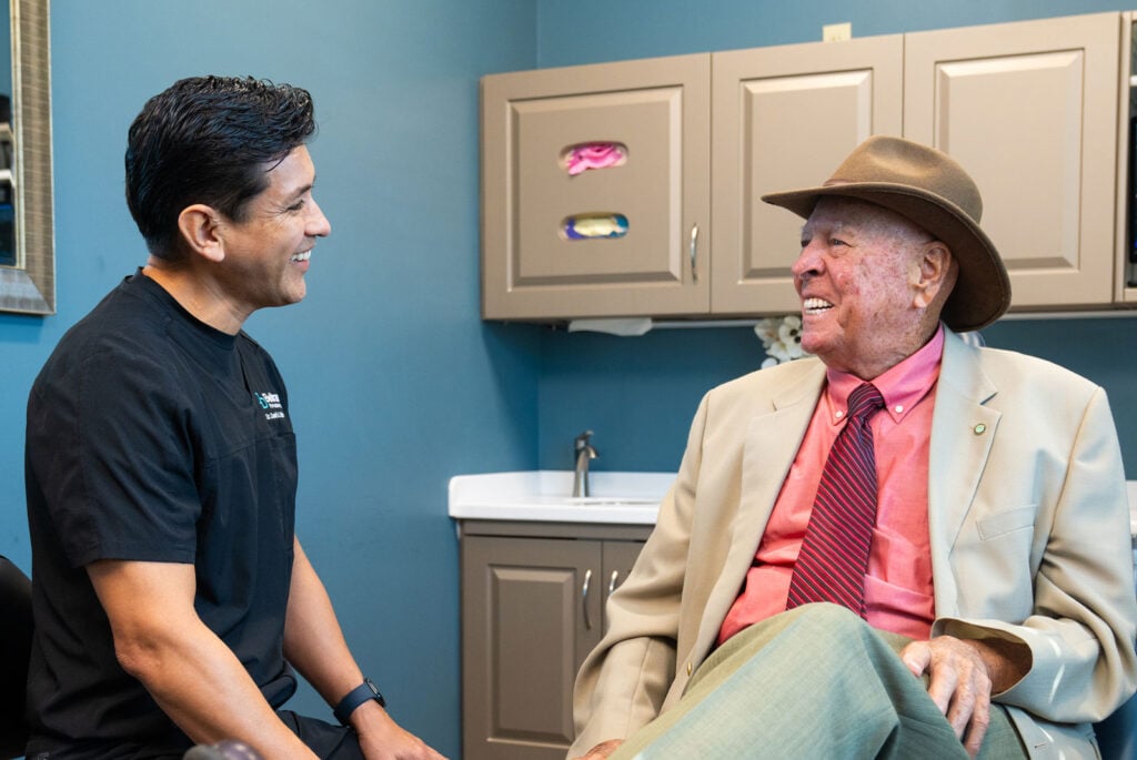 dr with jerome discussing dental implants